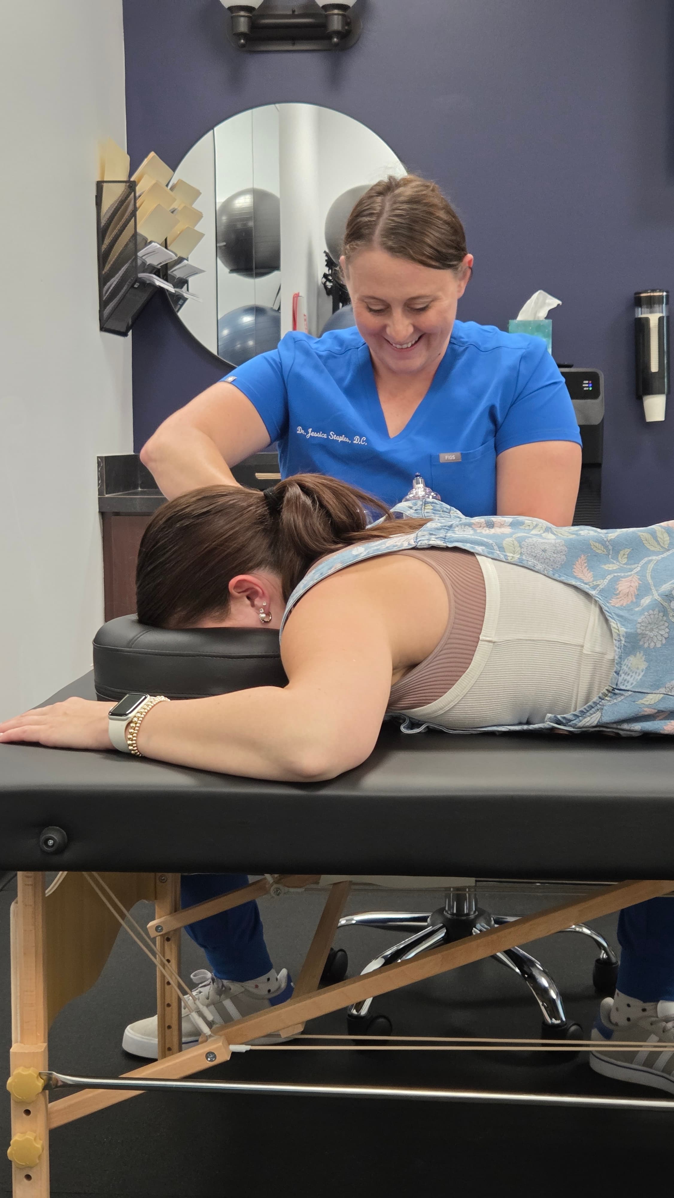 Dr. Jessica Staples providing cupping therapy to a patient at Back to Balance